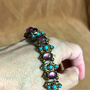 vintage 60s antique gold tone bracelet with purple and blue stones.